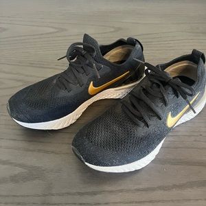 Women’s Nike Epic React Sneakers Size 7. Black with gold. Worn, great condition